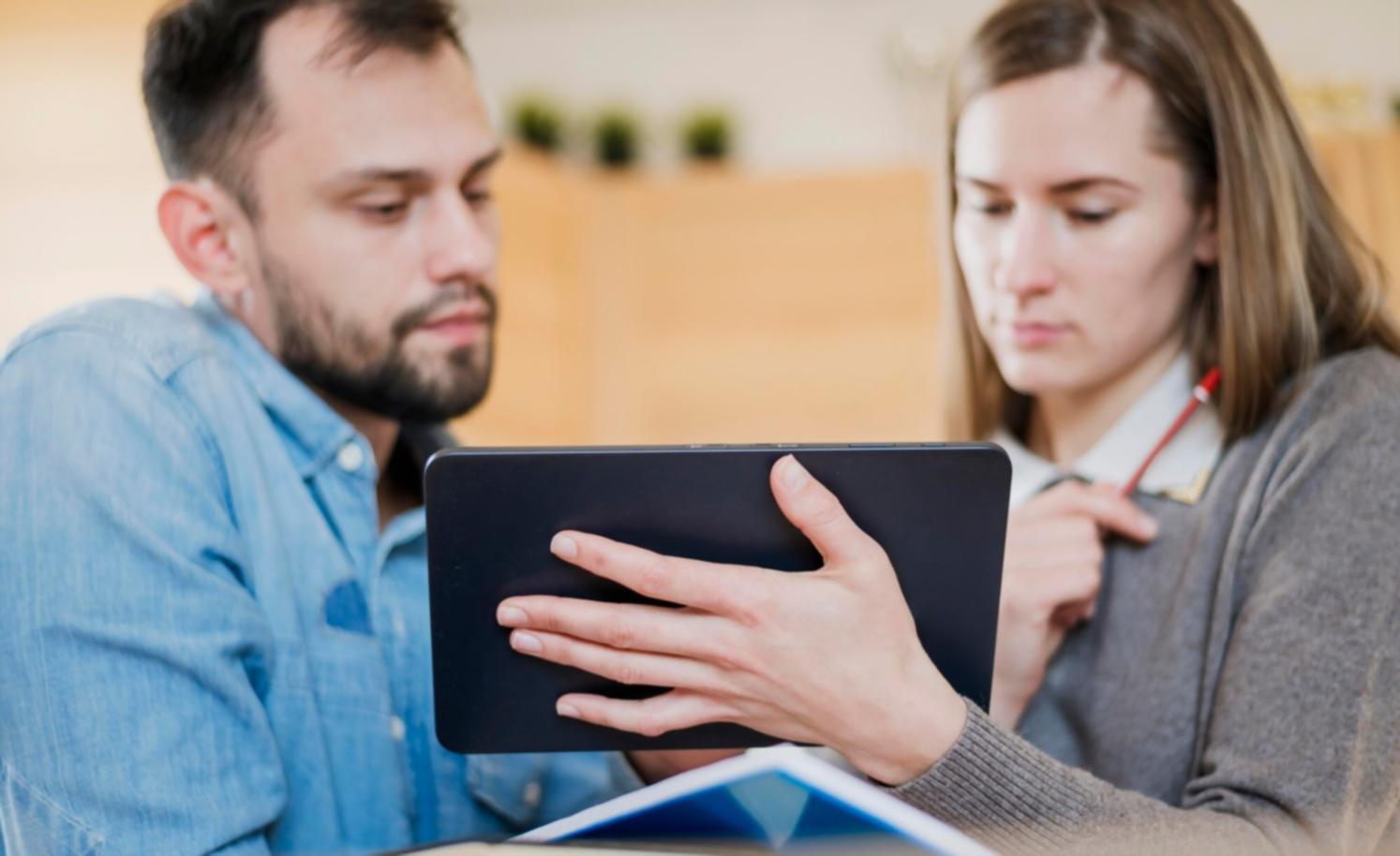 Modern office environment with financial planning resources and comfortable meeting space